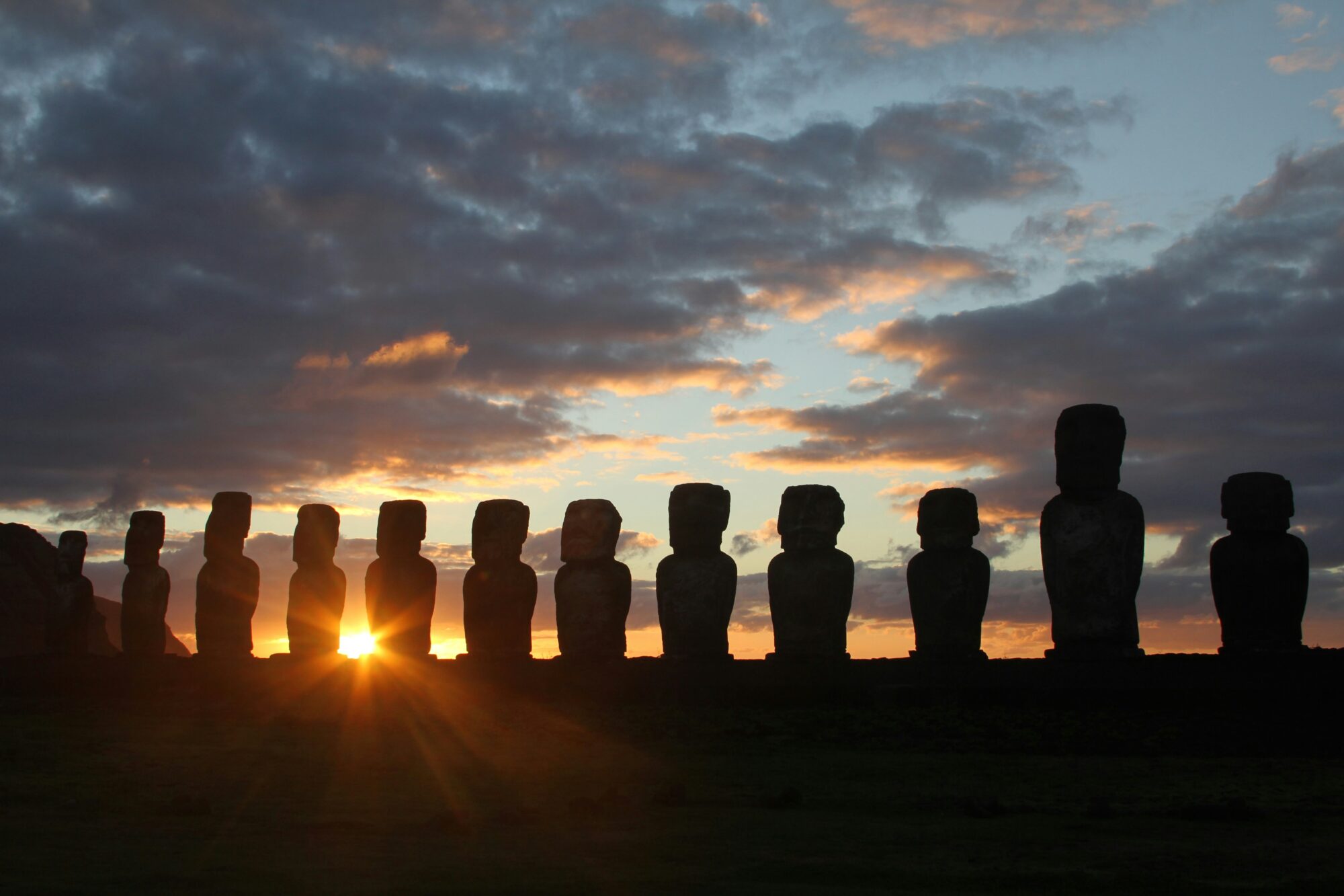 Moai silhouettes at sunset in Rapa Nui